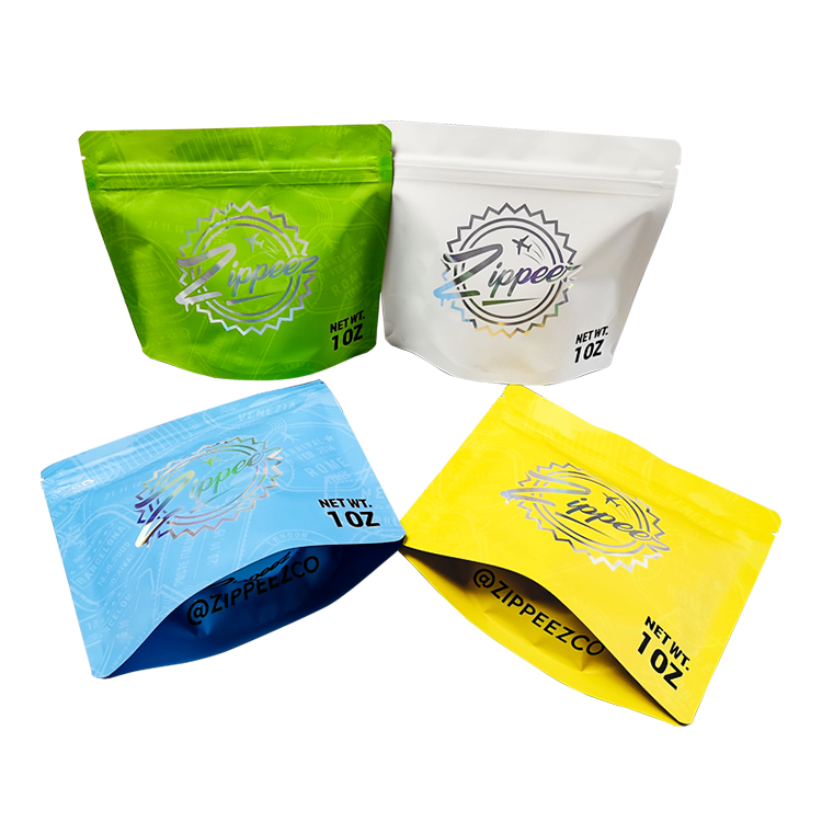 Colorful holographic stand-up pouches, including two laid down to show their opened bases