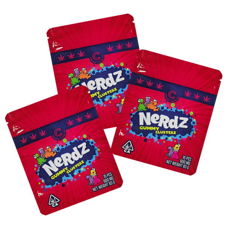 Three red printed gummy pouches with colorful graphics shown at different angles