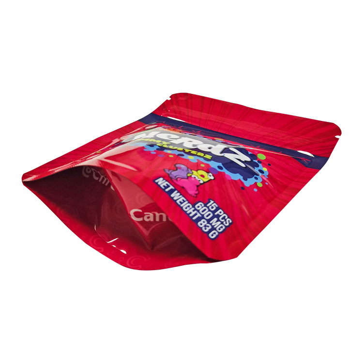 A red printed gummy pouch viewed at an angle