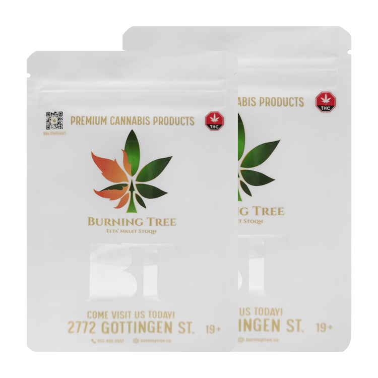 White flat zipper pouches with multicolored leaf artwork and printed product information