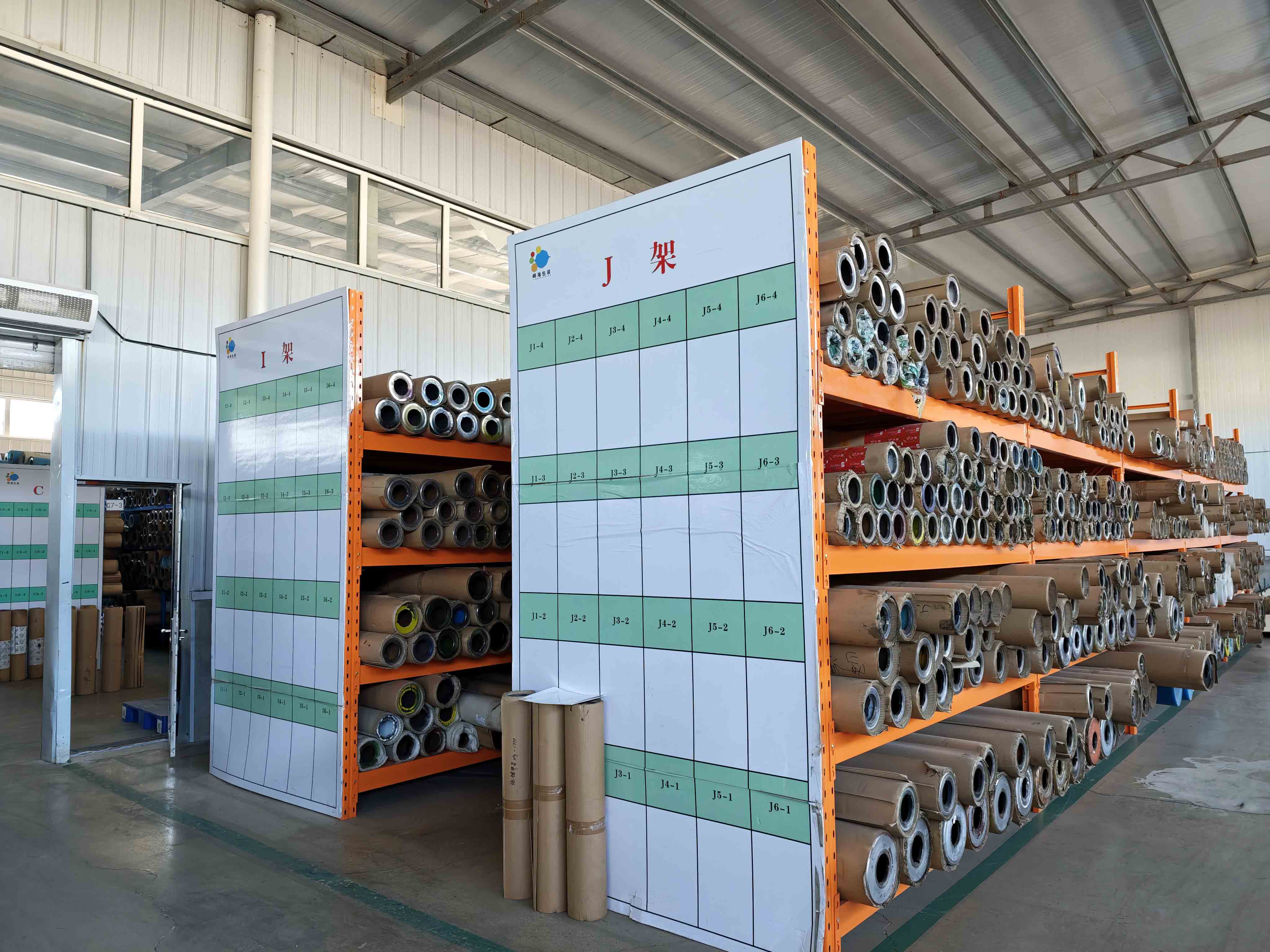 Gravure printing cylinders stored on racks in the flexible packaging factory
